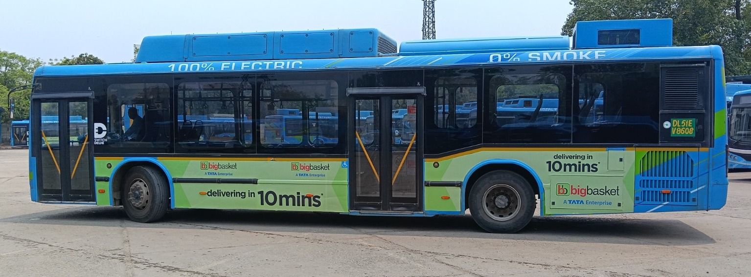 BigBasket branded side panels on a blue electric bus